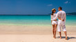 © haveseen - Couple in white on a beach