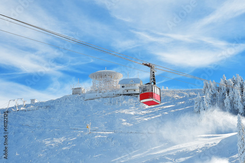 Cableway Lift Gondola Cabins On Winter Snowy Mountains Background