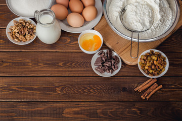 Baking cake in rural kitchen, dough recipe ingredients : eggs, flour, milk