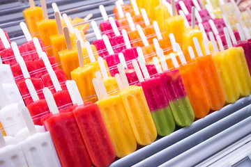 Wall Mural - assorted fruit popsicles on market stall