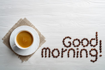 Poster - Coffee cup and beans on a white background.