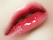 © looking2thesky - Close-up beautiful female lips with bright lipgloss makeup. Perfect clean skin, light fresh lip make-up. Beautiful spa macro shot with tender pink lip gloss. Spa and cosmetics