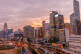 Fototapeta Nowy Jork - Aerial view of cityscape of landmark buildings along the Lung Wo Road, a road between Central and Wan Chai district in Hong Kong island at sunset.