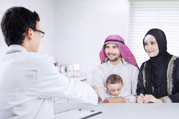 Poster - Family visits a pediatrician in the clinic