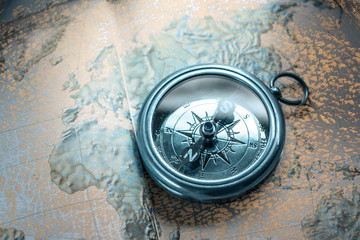 Wall Mural - Compass on map background