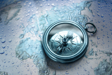 Wall Mural - Compass on map background