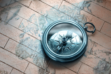 Wall Mural - Compass on map background