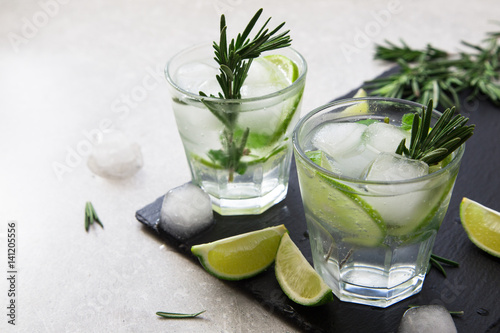 Fotografia, Obraz Lime Lemonade with rosemary and ice, selective focus