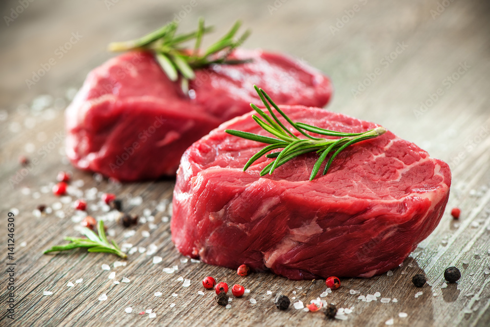 Raw beef fillet steaks with spices - obrazy, fototapety, plakaty 