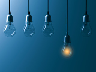 Fototapete - One hanging light bulb glowing different and standing out from unlit incandescent bulbs with reflection on dark cyan background , leadership and different business creative idea concept. 3D rendering.