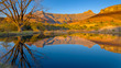 Drakensberg mountains of the amphitheatre reflected in a lake early on a mid-winter morning in South Africa