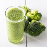 Fototapeta Kuchnia - Broccoli smoothie in glass bowl on white wooden background.