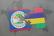 puzzle with the national flag of belize and mauritius on a world map