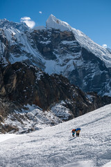 Wall Mural - Porters crossing Cho La pass in Everest region, Nepal