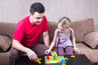 © hdmphoto - Dad and daughter playing table game