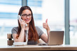 © Elnur - Young woman working in the office