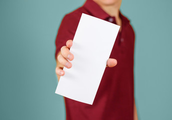 Wall Mural - Man showing blank white flyer brochure booklet. Leaflet presentation. Pamphlet hold hands. Man show clear offset paper. Sheet template. Booklet design sheet display read first person