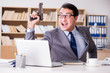 © Elnur - Funny businessman with gun in office