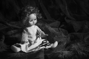 Old doll with scissors.