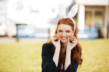 Portrait of a happy young woman with long ginger hair