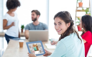 Poster - Smiling businesswoman using tablet 