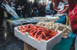 fresh raw seafoods on counter fish market
