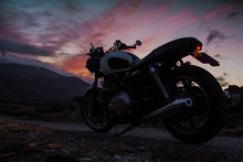 Café Racer Motorbike With Sunset Background