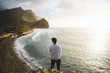 © Gerard Moral/ADDICTIVE STOCK - Male looking at cliffs and seashore