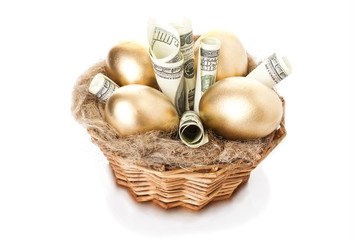 Nest with golden eggs on a white background