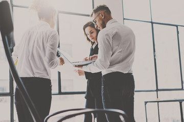 Wall Mural - Business team at working process.Young professionals work with new market startup. Project managers meeting.Panoramic windows on blurred background.Horizontal