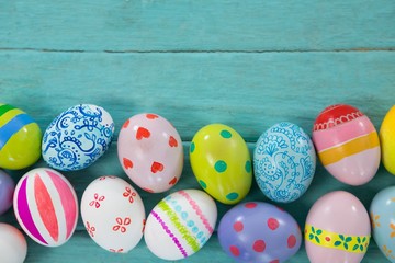 Wall Mural - Painted Easter eggs on wooden plank