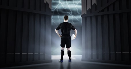 Poster - Composite image of rugby player holding a rugby ball 3d