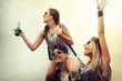 © NDABCREATIVITY - Happy group of friends enjoying festival