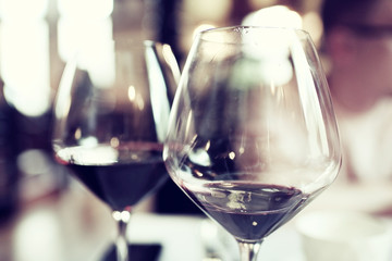 Serving a glass of red wine in a restaurant