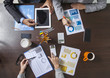 © dragonstock - Business People Working on an Office Desk