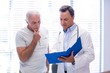 © WavebreakMediaMicro - Doctor and senior man discussing on file