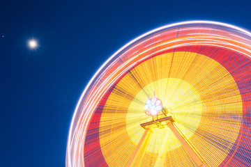 Motion Blurred Of High Speed Rotating Attraction Amusement Park.