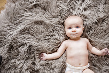 Portrait Of Baby Boy Lying On Fur