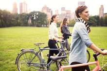 Young Women With Bicycles In Central Park