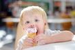 © Maria Sbytova - Cute little boy eating Ice-Cream gelato in indoors cafe