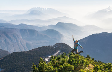 Poster - Happy success winning man on mountain summit jumps for joy
