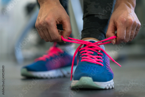 Running shoes - woman tying shoe laces Tableau sur Toile