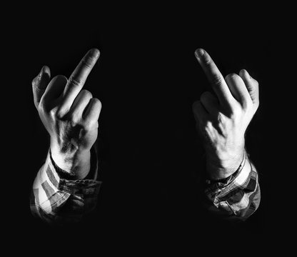 Fototapete - angry man, hand with middle fingers, on black background, concept of Hatred, dislike, discontent
