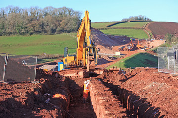 Wall Mural - Digger digging a trench