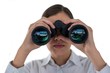 Businesswoman looking through binoculars 