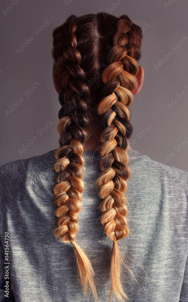 Young woman with beautiful hairstyle on color background