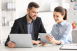 © Africa Studio - Young managers discussing issues in office