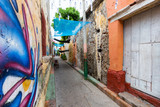 Fototapeta Na drzwi - Vibrant street art in an alley in the Getsemani neighborhood of Cartagena, Colombia.