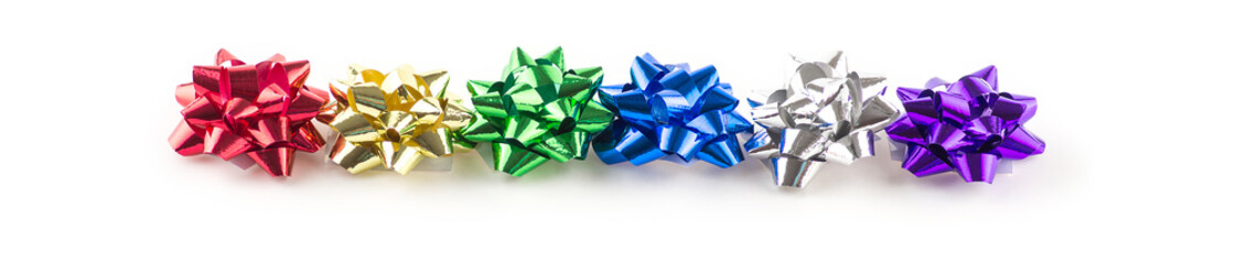 Macro closeup of green and blue gift bows on white background