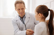 © zinkevych - Nice professional pediatrician making some tests